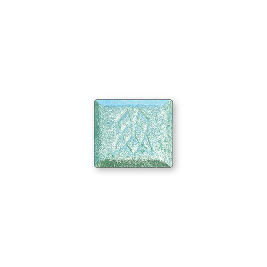 A single multichrome eyeshadow in colour Salt Water Pearl on a white background. A bright silver that has a sheer seafoam green base with aqua shifts and hints of warmth.