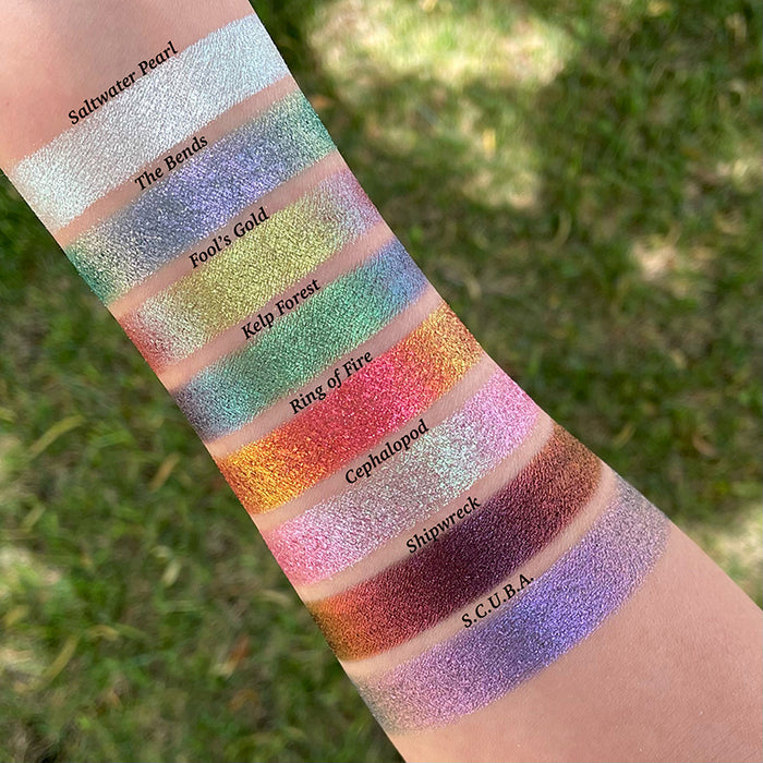 Arm swatches on fair skin tone of all eight eyeshadows included in the Deep Sea Treasures Palette.