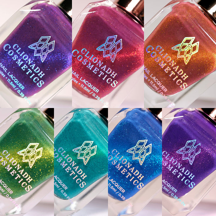 Close-up collage of seven bottles of nail polish from the Saturated Slick Nail Lacquer Collection.