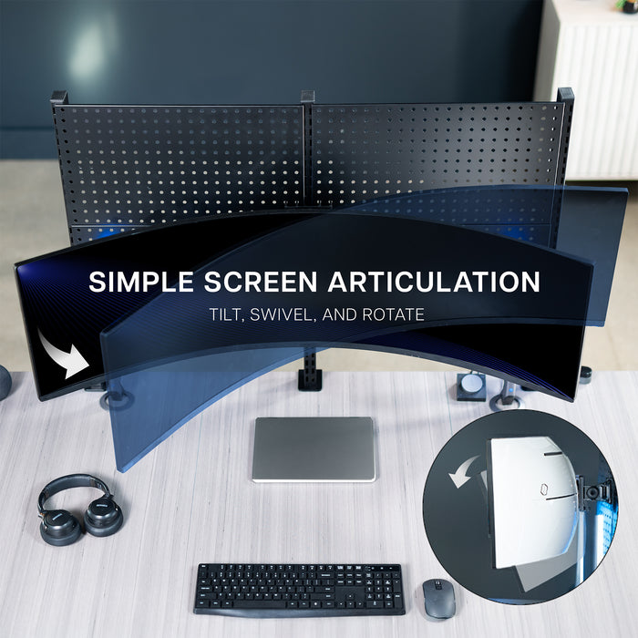 Screen articulation showcased in birds eye view of a desk with pegboard and pegboard monitor mount.