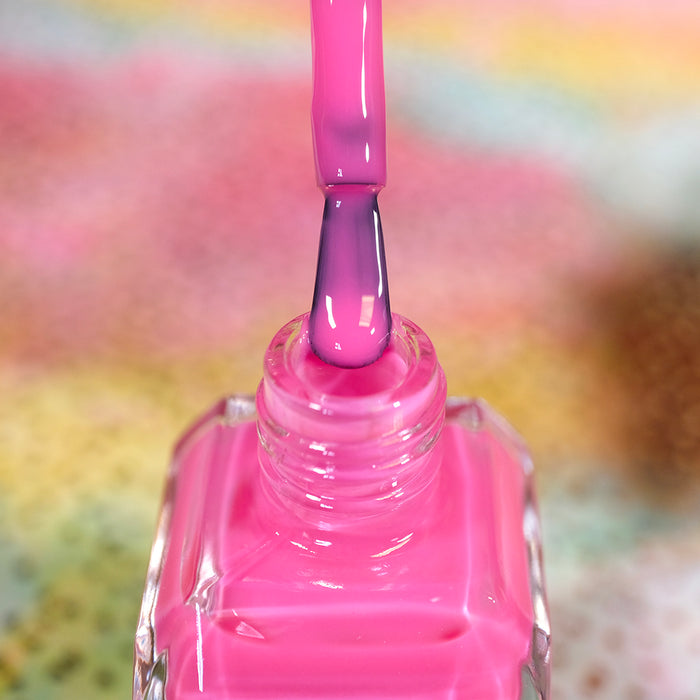 Close-up of opened nail polish bottle containing Stratus Nail Lacquer, with brush showing.