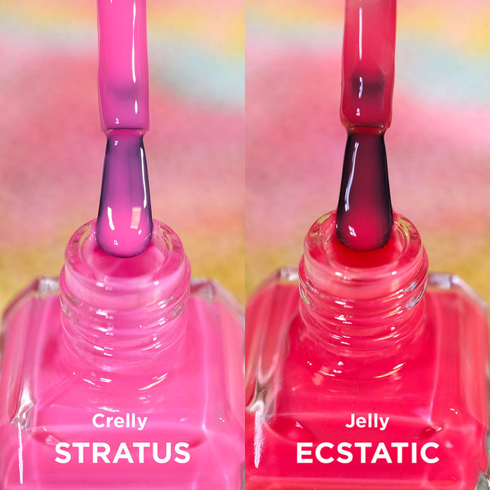 Two open bottles of nail polish with brushes showing. Comparing pinks of Stratus and Estatic Nail Lacquers.