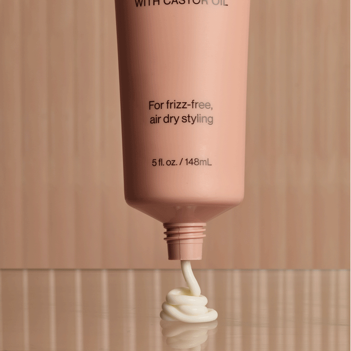 KITSCH Smoothing Air Dry Cream — animated product shot showing bottle from multiple angles — Infused with Castor Oil, Squalane, Panthenol & Coconut Oil to nourish, hydrate, and protect — sheer, non-greasy formula won't weigh hair down