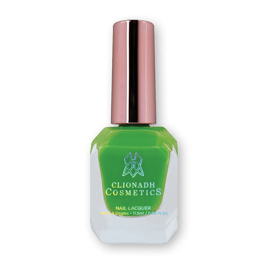 Bottle of nail polish containing Thrilled Nail Lacquer on white background.