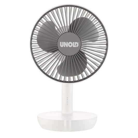 Vor einem schlichten weißen Hintergrund ist ein kompakter, weiß-grauer Tischventilator mit drei Flügeln der Marke „Unold“, Modell TISCHVENTILATOR BREEZY, zu sehen.