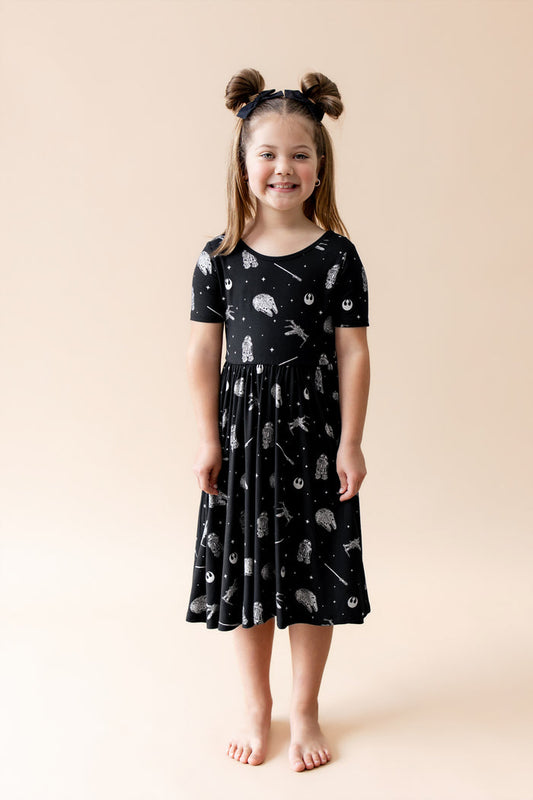 Young girl wearing the Twirl Dress in STAR WARS™