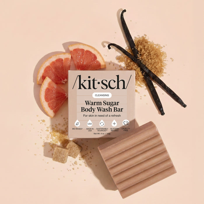 KITSCH Cleansing Warm Sugar Body Wash Bar — lifestyle product shot with vanilla and grapefruit props — Infused with decadent notes of warm vanilla, spun sugar, and pink grapefruit — leaves skin wrapped with a sweet gourmand scent