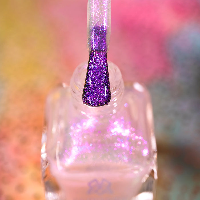 Close-up of opened Walking on Air Nail Lacquer bottle with the brush showing. Emphasizes iridescent shimmer particles.