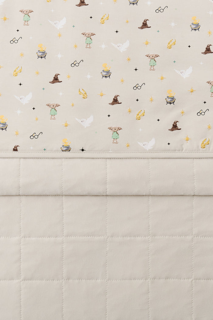 Beige Youth Blanket with Harry Potter pattern print with plain beige fabric at the back