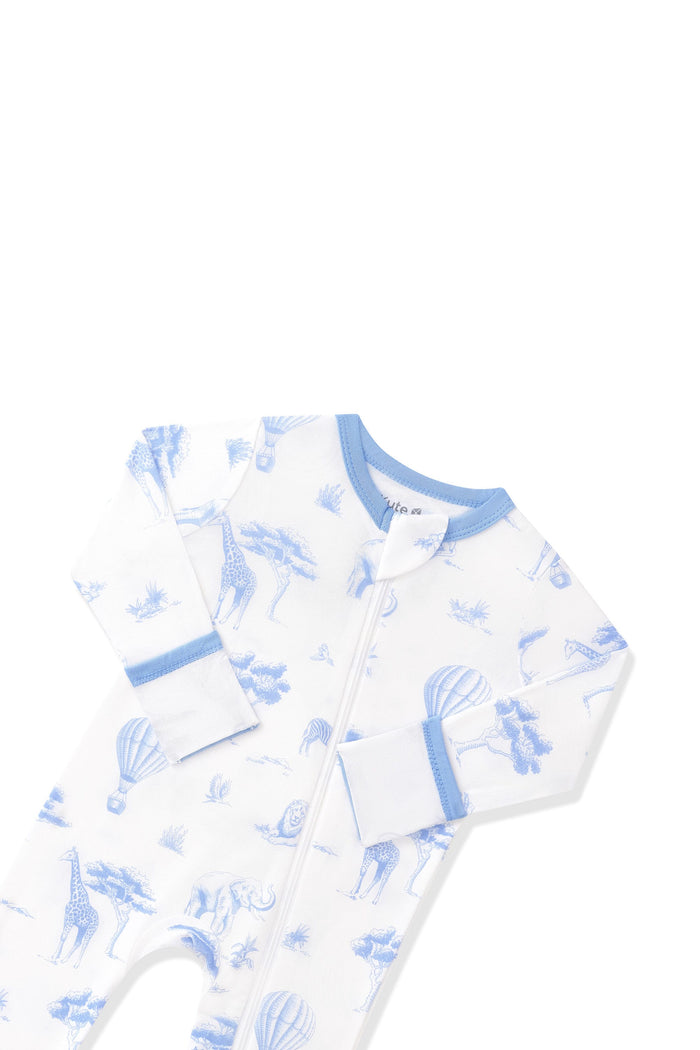 Close up of the zipper garage and fold over hand cuffs shown on the Zippered Romper in Toile Safari